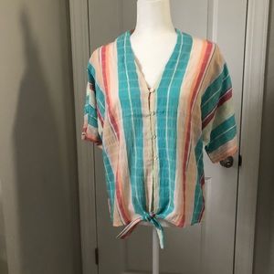 Short sleeve button-down blouse with multiple colors and ties on the bottom.